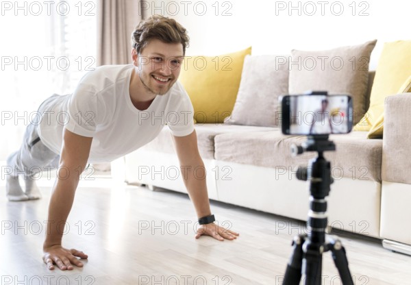 handsome male recording personal training home