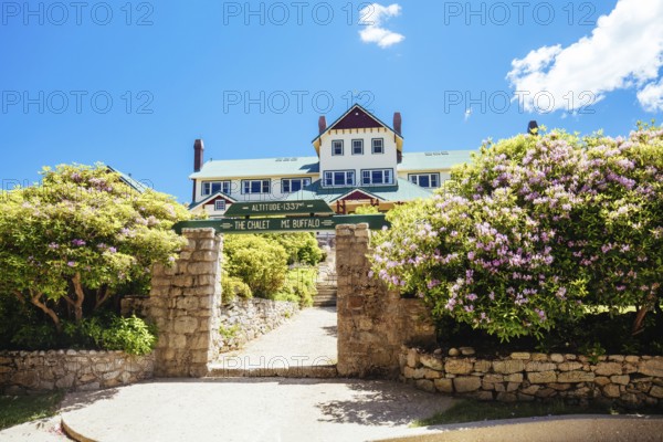 MT BUFFALO, AUSTRALIA- DECEMBER 29 2021: The Mount Buffalo Chalet on a warm summer's day. It was built in 1910 as Australia's first ski resort in the Victorian Alps and is a historic landmark in Victoria, Australia, Oceania