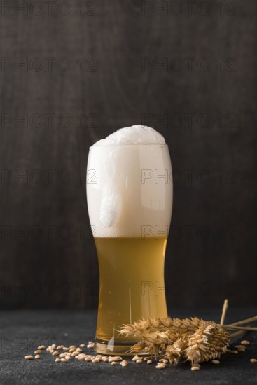 Glass blonde beer with foam