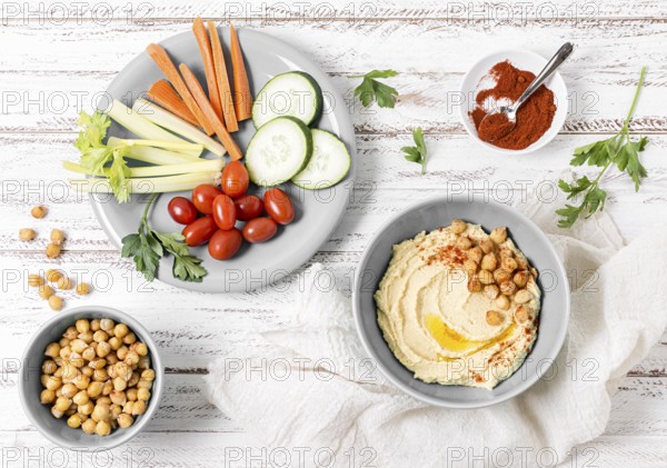 Top view vegetables with hummus