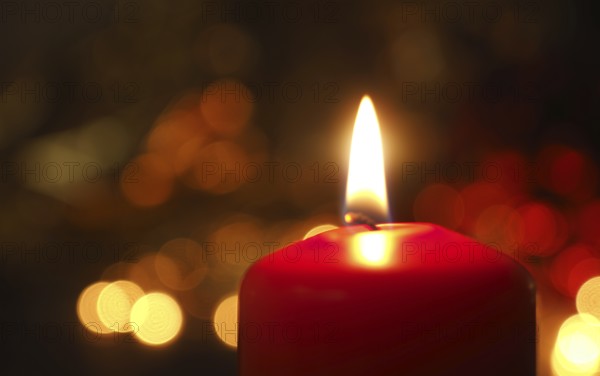First Advent candle burning with Christmas decoration on a wooden table
