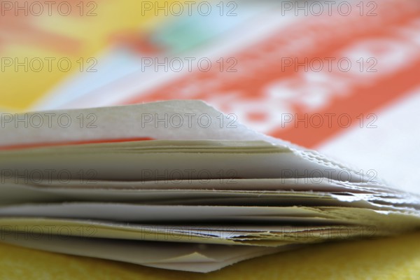 A newspaper lies on a table