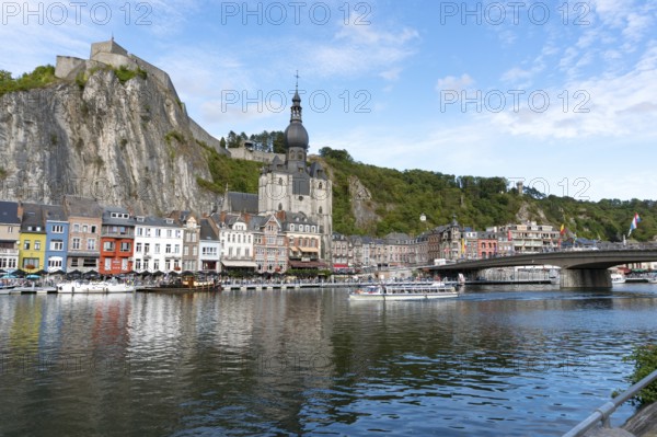 Belgium - 11 August 2019: view of the small town of Dinant with Maas river and citadel and cathedral in the old town