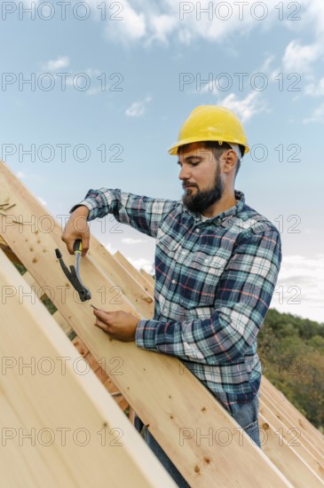 Worker building roof house
