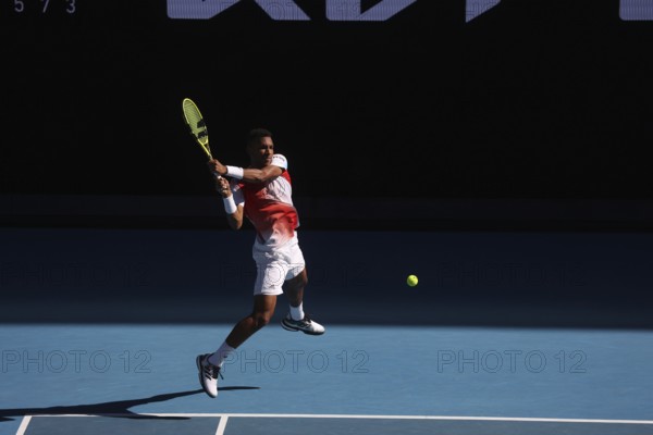 MELBOURNE, AUSTRALIA, JANUARY 24: Felix Auger-Aliassime of Canada on his way to beating Marin Cilic of Croatia on day 8 of the 2022 Australian Open at Melbourne Park on January 24, 2022 in Melbourne, Australia, Oceania