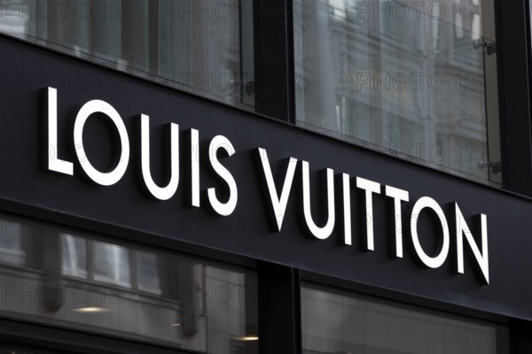 Close-up, logo of the French luxury fashion brand Louis Vuitton on a boutique in the shopping street Neuer Wall, Hamburg, Germany, Europe