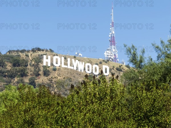 The Hollywood Sign (formerly the Hollywoodland Sign) is a landmark and American cultural icon located in Los Angeles, California. It is situated on Mount Lee in the Hollywood Hills area of the Santa Monica Mountains. The sign overlooks the Hollywood dist