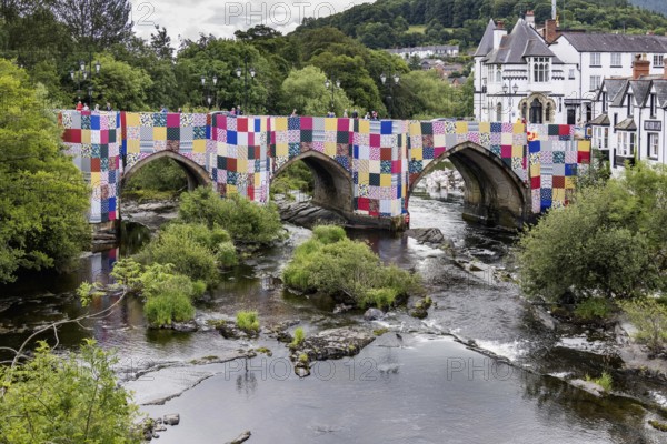 LLANGOLLEN, DENBIGHSHIRE, WALES - JULY 11 : View along the River Dee in LLangollen, Wales on July 11, 2021. Unidentified people