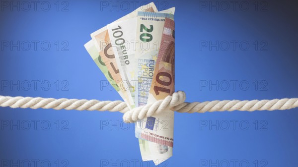 Arrangement banknotes rope. High resolution photo