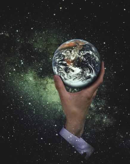Hand of Man Handing The Earth