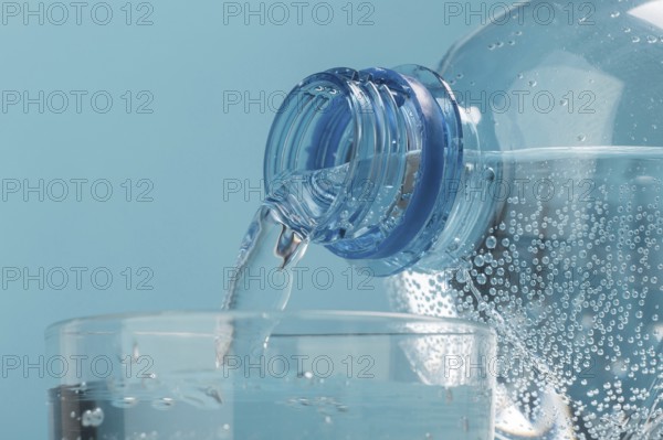 pouring sparkling water in cup . Resolution and high quality beautiful photo
