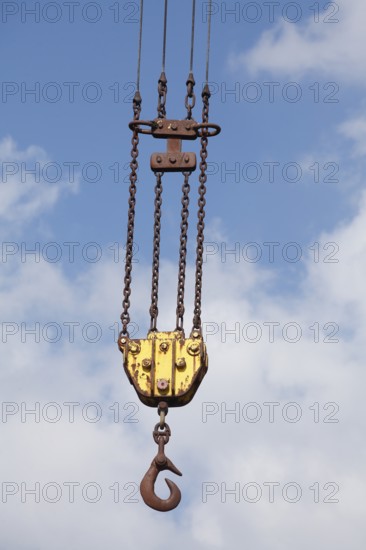 Orange cargo hook with carabiner on a harbour crane, Elsfleth, Lower Saxony, Germany, Europe
