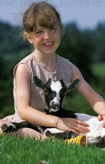 GIRL WITH PYGMY GOAT (capra hircus)