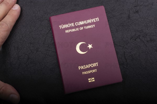 New Turkish passport. Travel, tourism, emigration and passport control concep