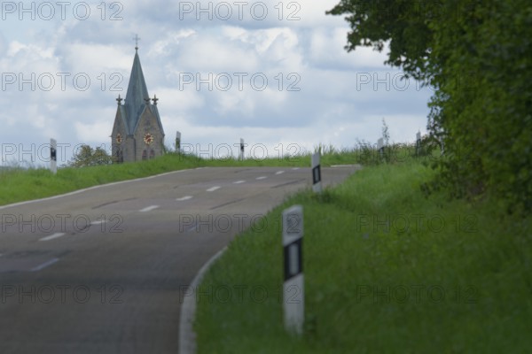 Country road with a view of the village church in Bibersfeld, Swabian-Franconian Forest nature park Park, Schwäbisch Hall, Hohenlohe, Heilbronn-Franconia, Baden-Württemberg, Germany, Europe