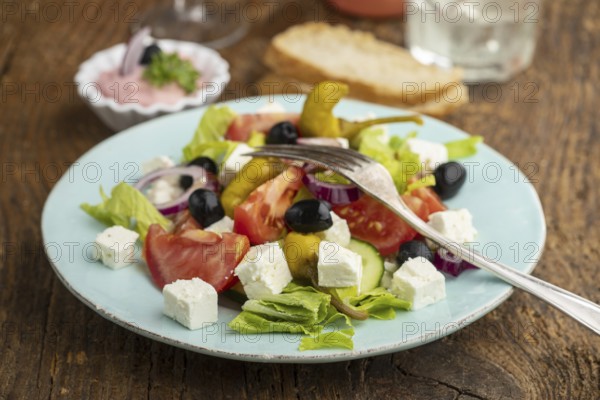 Greek salad with feta cheese and olives