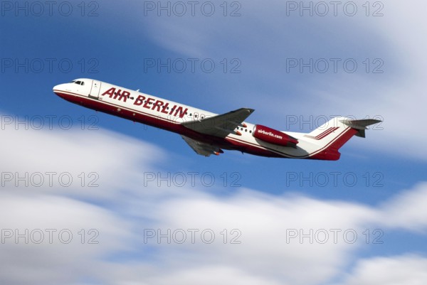 Airplane of Airline Air Berlin, takeoff, with blue sky and white clouds, motion blur showing speed of travel, velocity, Airport Munich, Bavaria, Germany, Europe