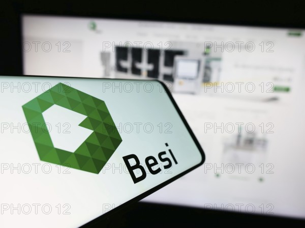 Stuttgart, Germany, 11-11-2023: Cellphone with logo of Dutch company BE Semiconductor Industries NV (Besi) in front of business website. Focus on center of phone display, Europe