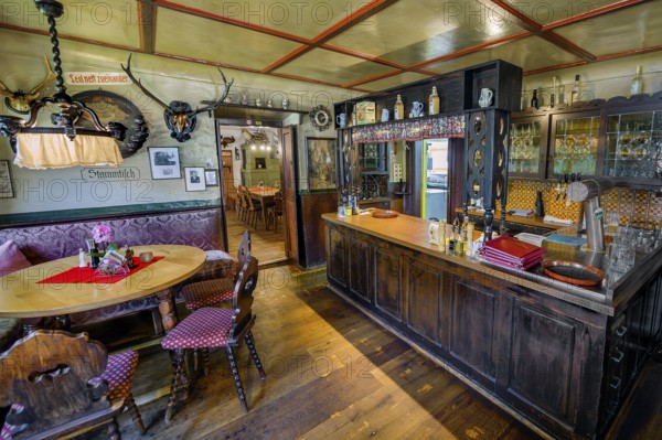 Regulars' table and bar in the Gasthof Adler, heritage-protected historic country inn, built around 1500, Großholzleute, Allgäu, Bavaria, Germany, Europe