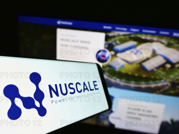 Stuttgart, Germany, 01-06-2022: Smartphone with logo of American nuclear power company NuScale Power LLC on screen in front of business website. Focus on left of phone display, Europe