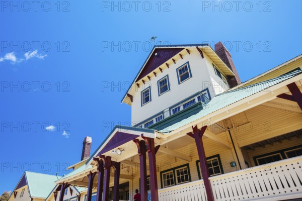 MT BUFFALO, AUSTRALIA- DECEMBER 29 2021: The Mount Buffalo Chalet on a warm summer's day. It was built in 1910 as Australia's first ski resort in the Victorian Alps and is a historic landmark in Victoria, Australia, Oceania