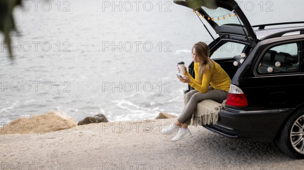 Pretty young woman enjoying road trip