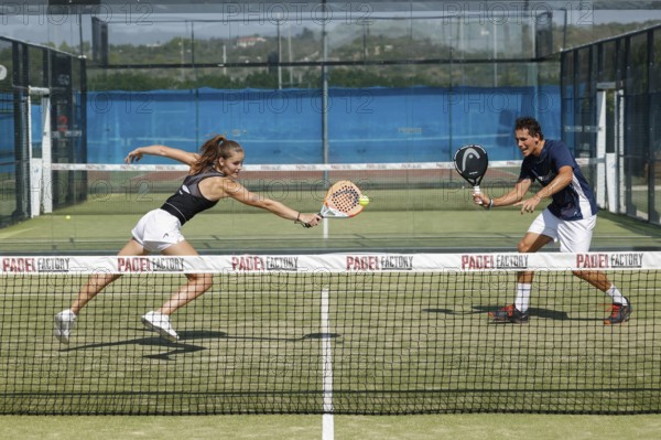 Young couple playing padel at the Club Robinson in Ugento, Apulia, Italy, Europe