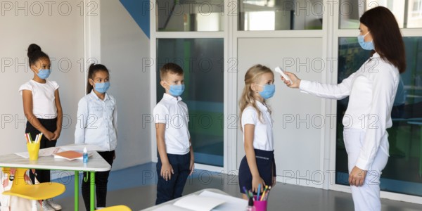 Side view kids waiting line temperature measurements