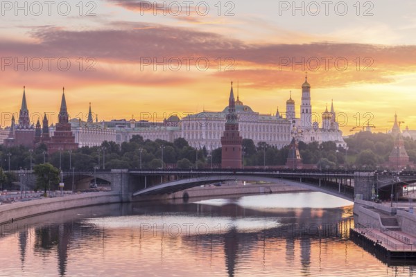Moscow Kremlin and Moscow River with bridge in the summer sunny morning. Colorful sky. Russia