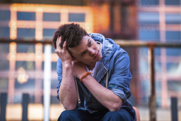 young man lost in thought