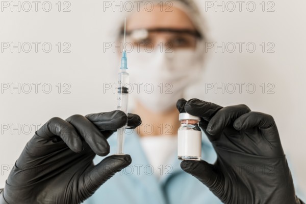 Front view female doctor with vaccine gloves
