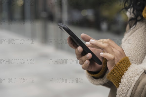 Woman using her smartphone outside with copy space. Resolution and high quality beautiful photo