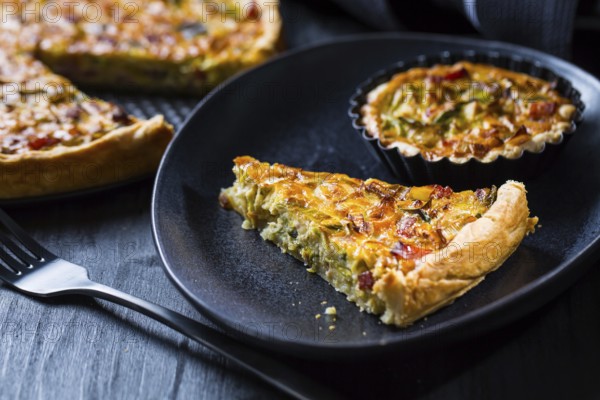 Quiche Lorraine - traditional French tart with pastry crust filled with bacon and leek