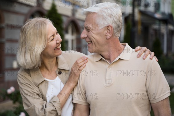 Smiley elder couple taking walk city together