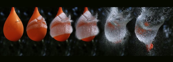 Shot Breaking Water Filled Orange Balloon