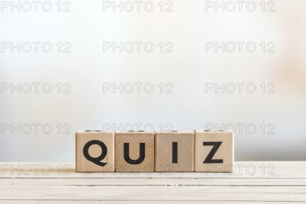 Quiz sign made of wood on a wooden table