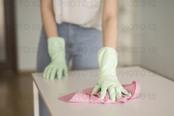 Front view defocused woman cleaning surface. Resolution and high quality beautiful photo