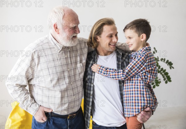 Family men different generations hugging together