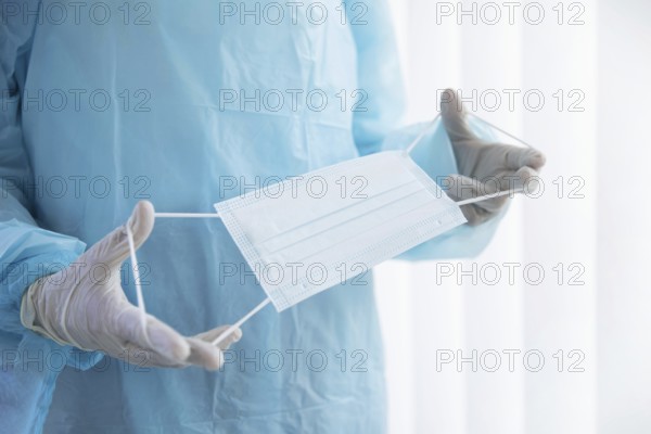 doctor holding medical mask