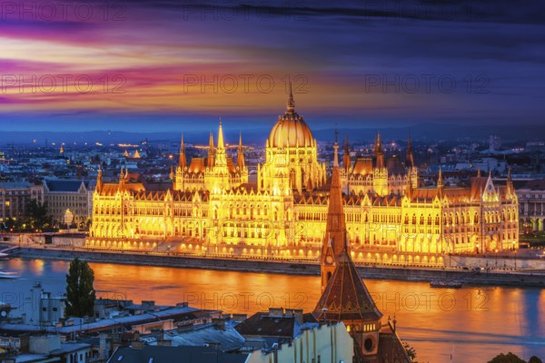 Panoramic view of Budapest with Hungarian Parliament Building on the bank of the Danube after sunset