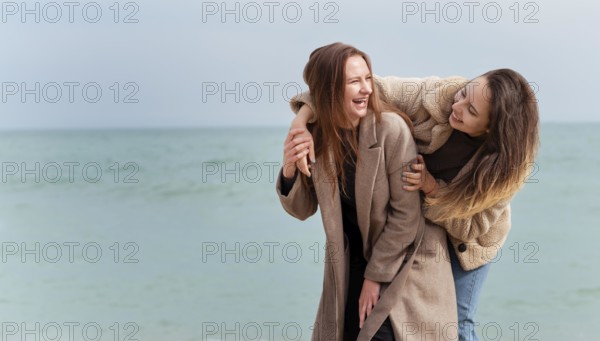 Meidum shot happy women seaside