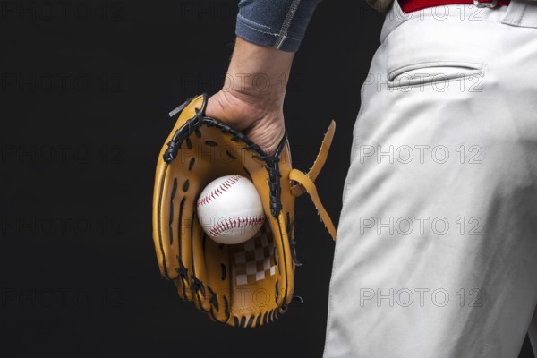 Back view man holding glove with baseball. Resolution and high quality beautiful photo