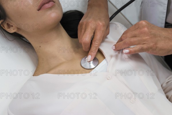 Doctor checking heart rate patient