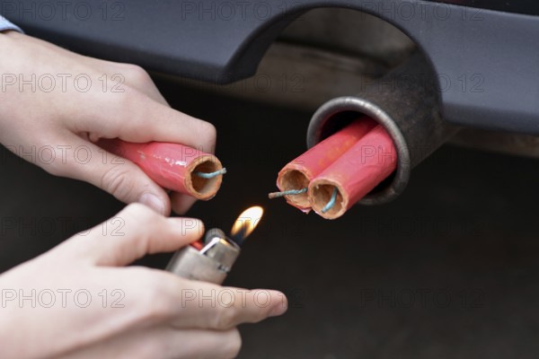 Chinese firecrackers in car exhaust, lighter, firecrackers, fireworks, firecrackers, Chinese firecrackers, ignite, destruction, destructiveness, damage to property, Chinese firecrackers, fireworks