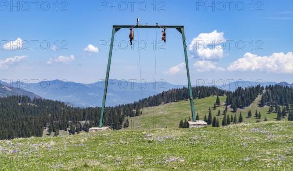 A picture of the landscape of Velika Planina, or Big Pasture Plateau, as seen through a ski lift small tower