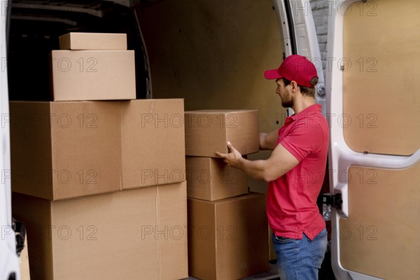 delivery man car taking packages. High resolution photo
