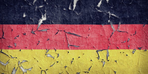 Wall paint of Germany flag is peeling off. Wall with painted Germany flag is peeling off
