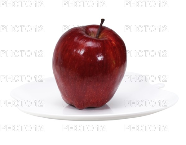Red apple on a apple shaped dish isolated over white