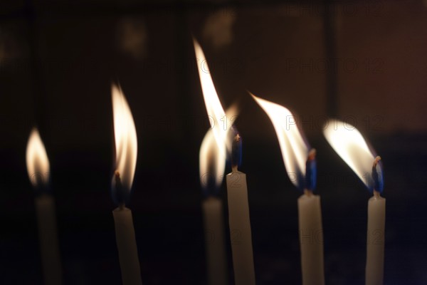 Candle lights in the darkness. Abstract candles background. Hope, fire