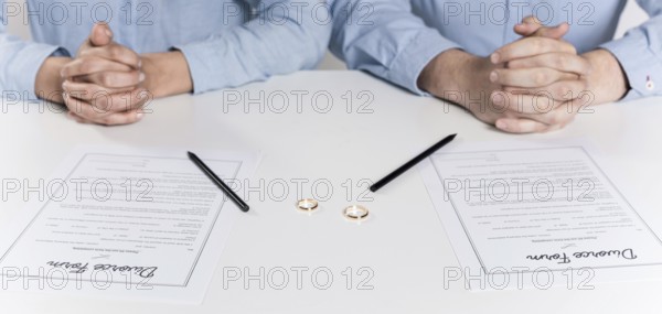 Couple getting ready sign divorce forms